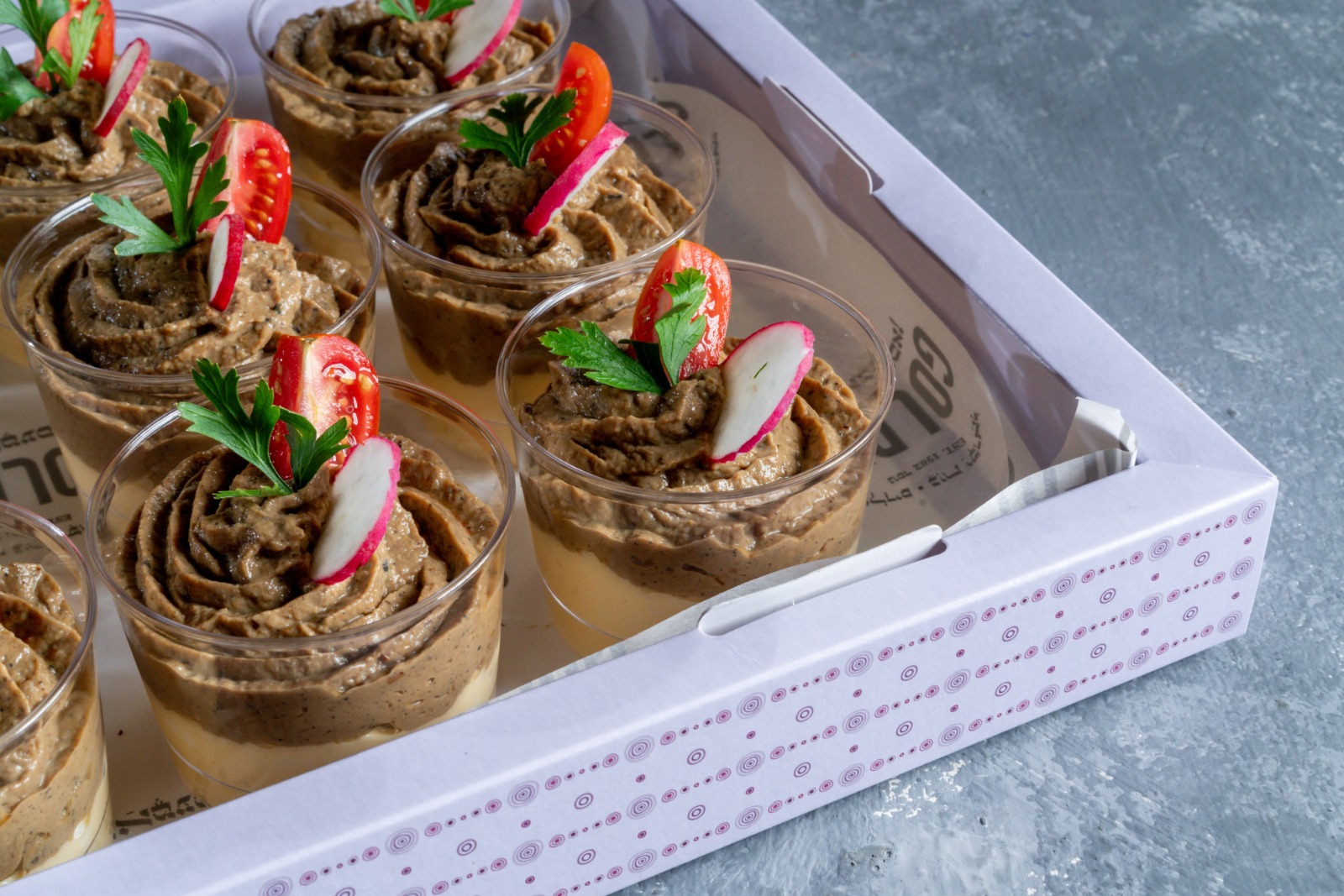 A tray of egg mousse salad and chopped liver in cups