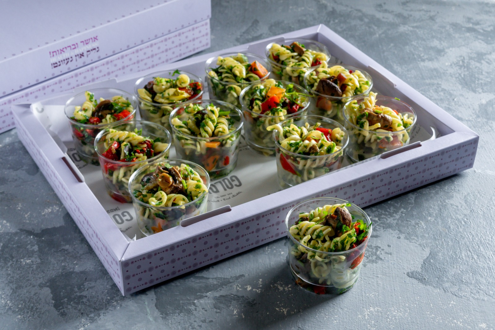 A tray of pasta salad cups
