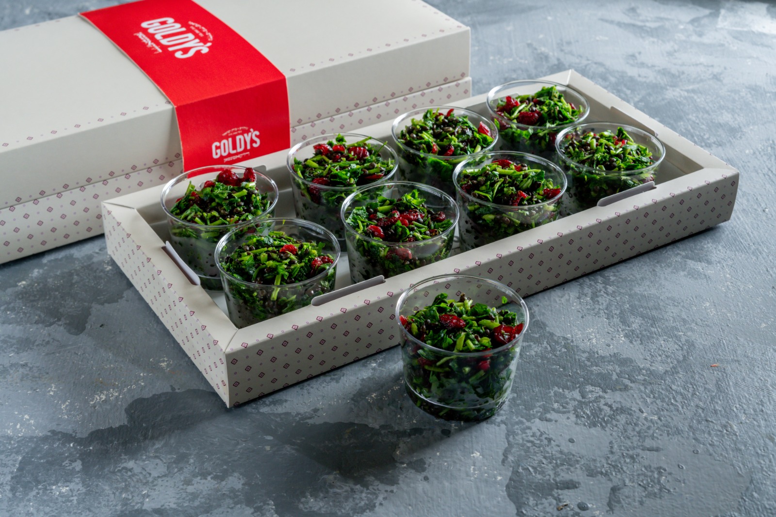 A tray of herbs & cranberries salad cups